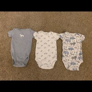 Three Carter’s onesies.